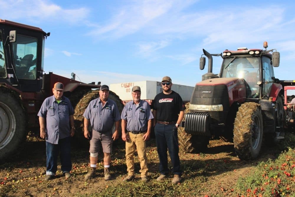 Image of Dei Fratelli Tomatoes with grower's daughter in a local field
