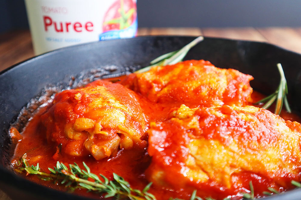 Image of our Italian Braised Chicken Recipe in a cast iron skillet