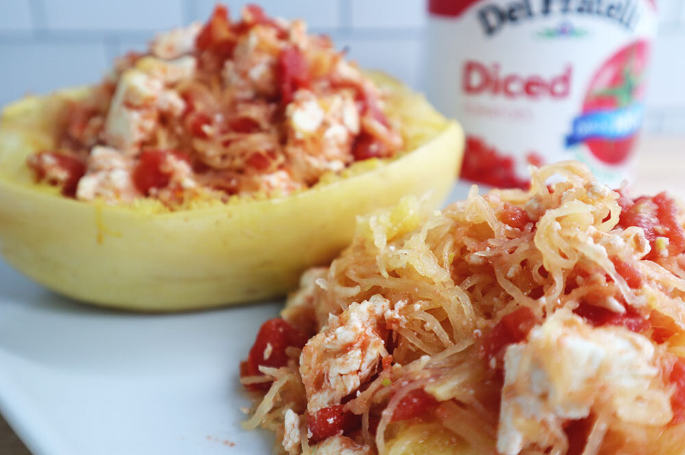 Image of our Easy Baked Feta Spaghetti Squash recipe served in the squash halves.